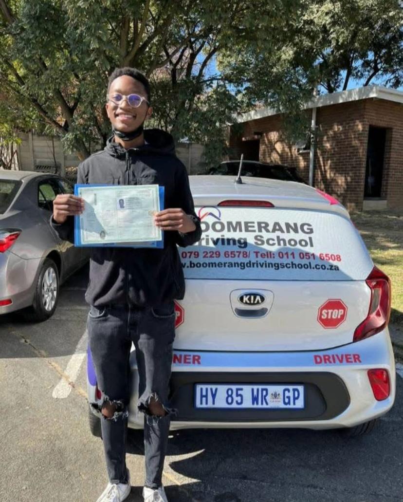 Boomerang Driving School learner driver with instructor in car